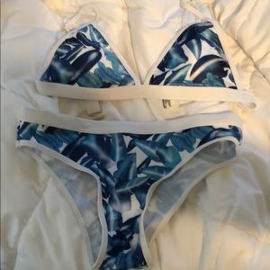 Never been worn. Bottoms are a bit high waisted